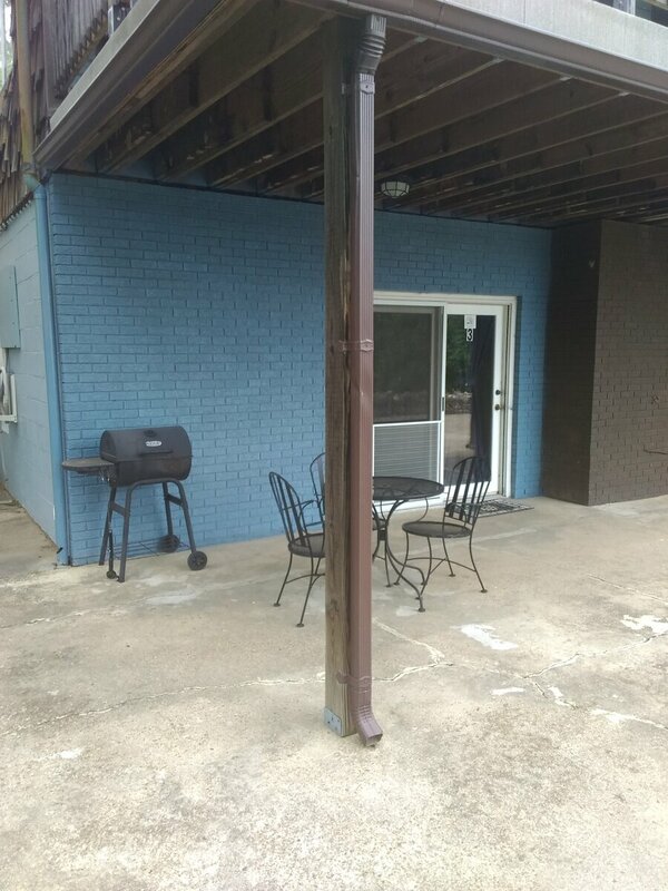Cabin #3 Front Door, Charcoal Grill and Patio Table and Chairs 