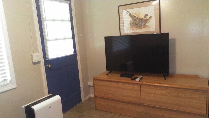 Back door to Covered Porch, Charcoal Grill, Table and Chairs